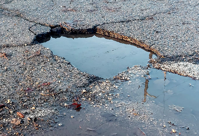 Pothole on Ann Arbor Road in Plymouth Michigan