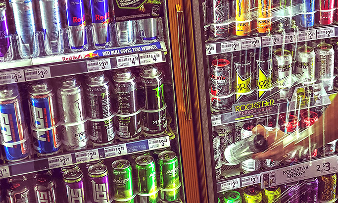 Energy drink cooler with hand reaching in for one