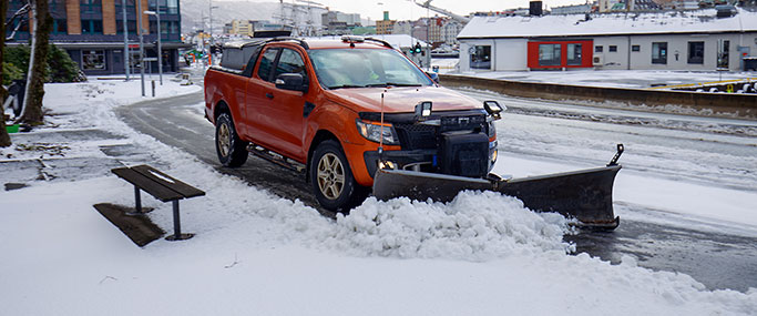 Truck plowing snow in the city