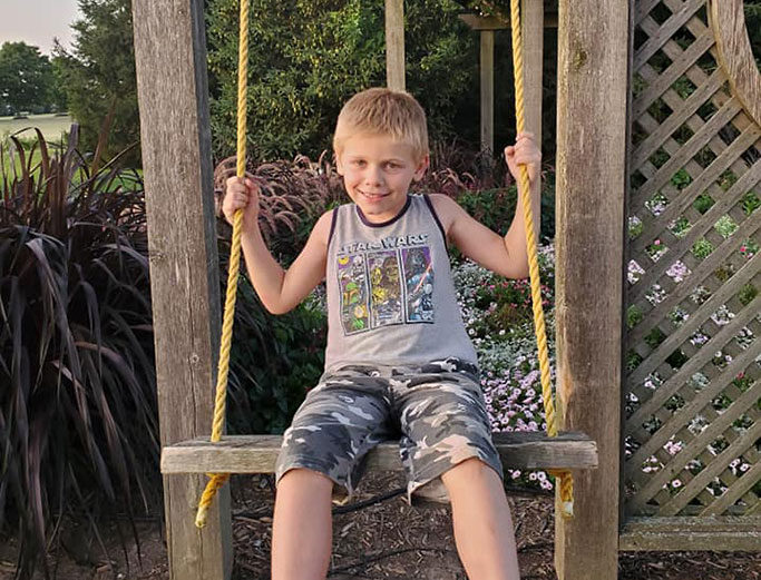 Otto on a swing in the garden